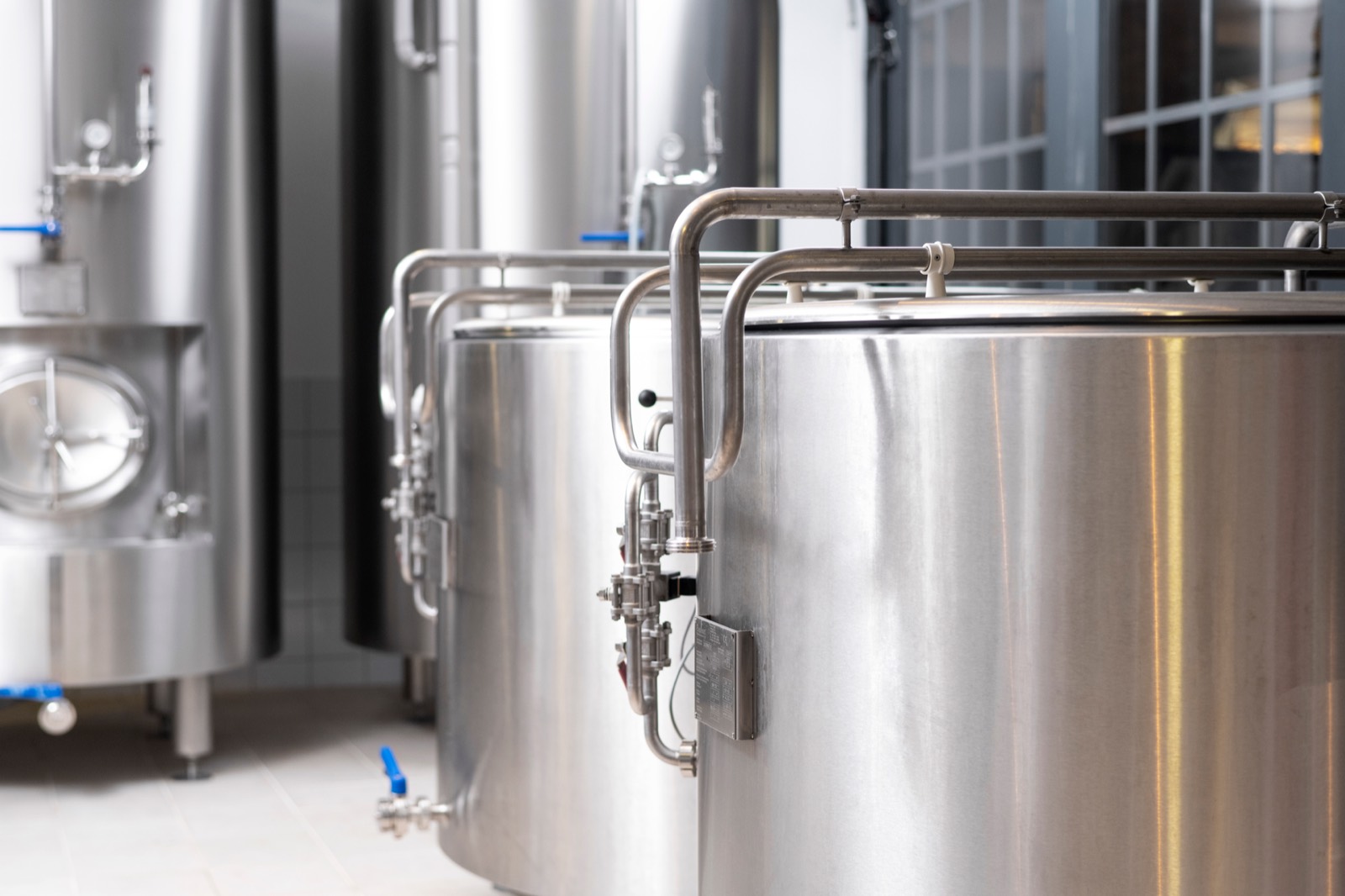 Stainless steel tanks inside a production facility